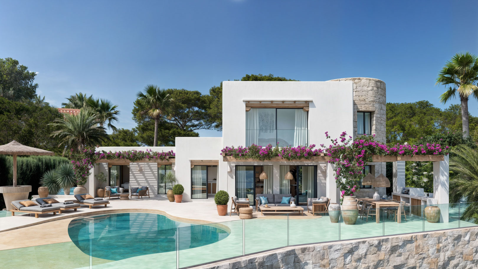 Exterior de la villa con piscina de diseño orgánico, torre de piedra natural y pérgolas de madera con buganvillas, integrando espacios de relax y comedor al aire libre.