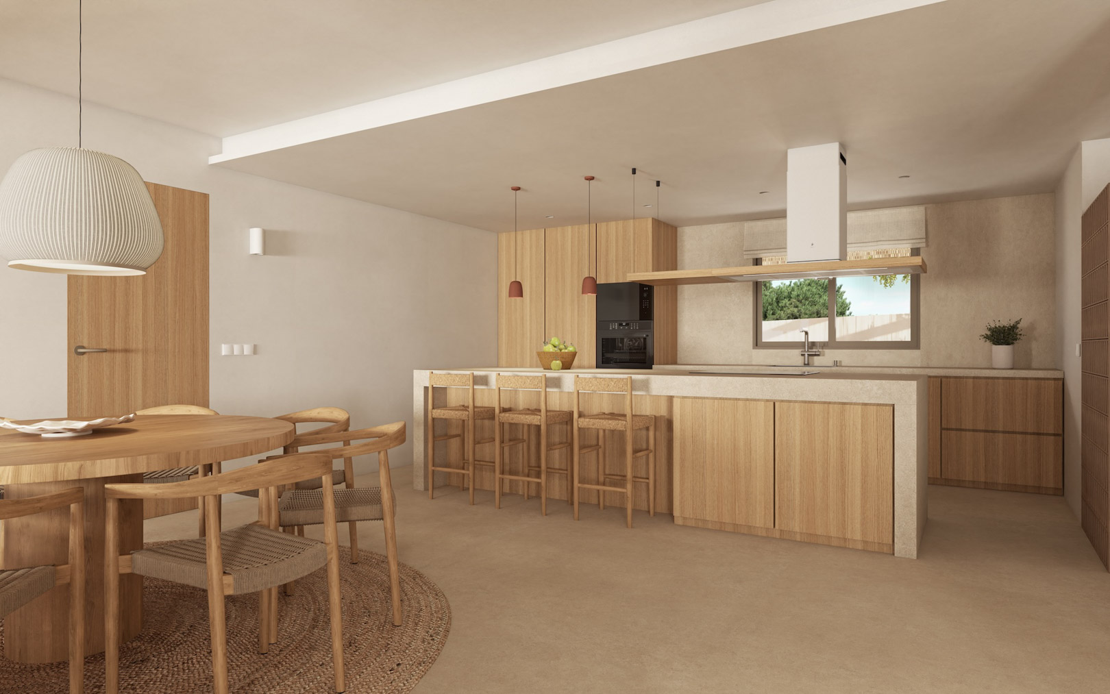 Cocina de concepto abierto con isla de piedra, armarios de madera natural y comedor integrado con mesa redonda y sillas de fibras naturales.