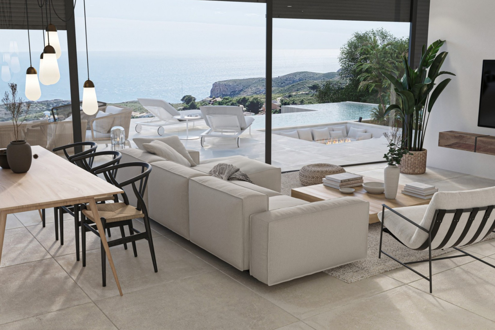 Salón luminoso con vistas al mar, comedor con sillas de diseño y acceso a terraza con piscina infinita.