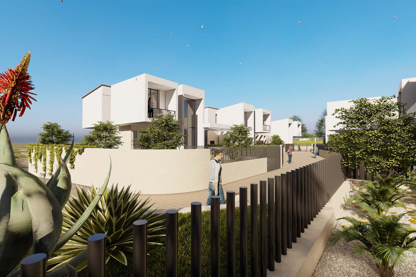 Fachada exterior de villas blancas de estilo cúbico con balcones de cristal, integradas en un entorno con muros perimetrales y vegetación mediterránea.