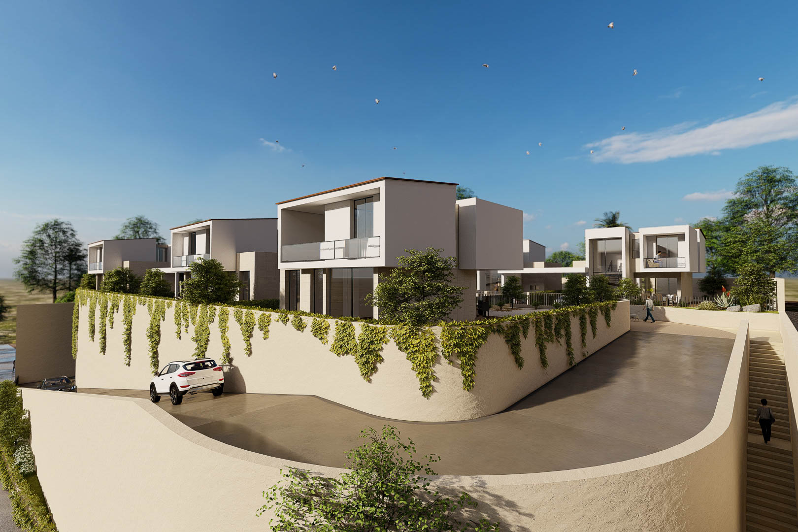 Vista exterior del complejo con villas de diseño cúbico, fachadas blancas y muros perimetrales con vegetación colgante junto al acceso pavimentado.