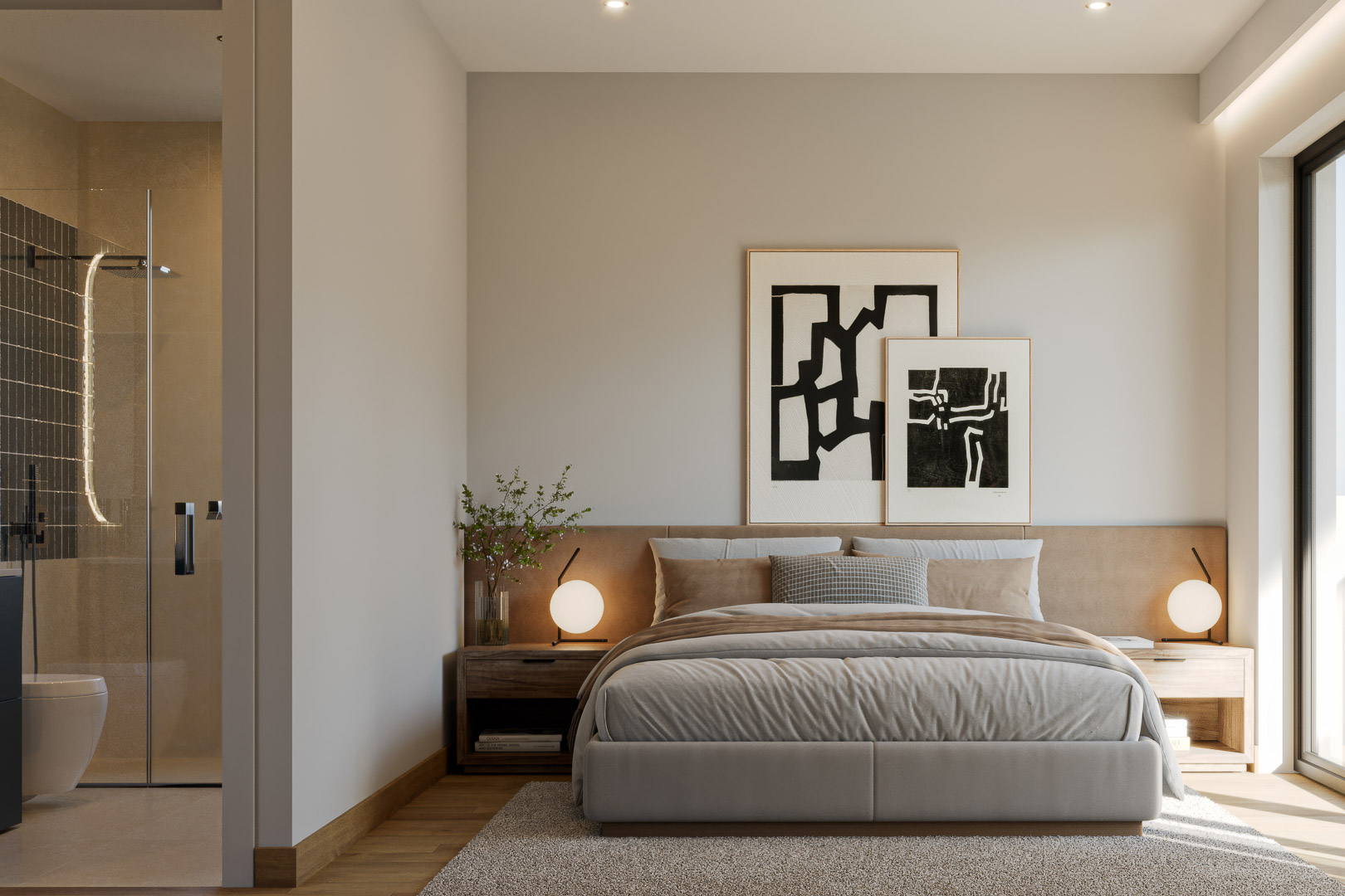Dormitorio principal con baño en suite, suelos de madera y cabecero tapizado. El baño integrado incluye una ducha de obra con mampara de cristal y acabados contemporáneos.