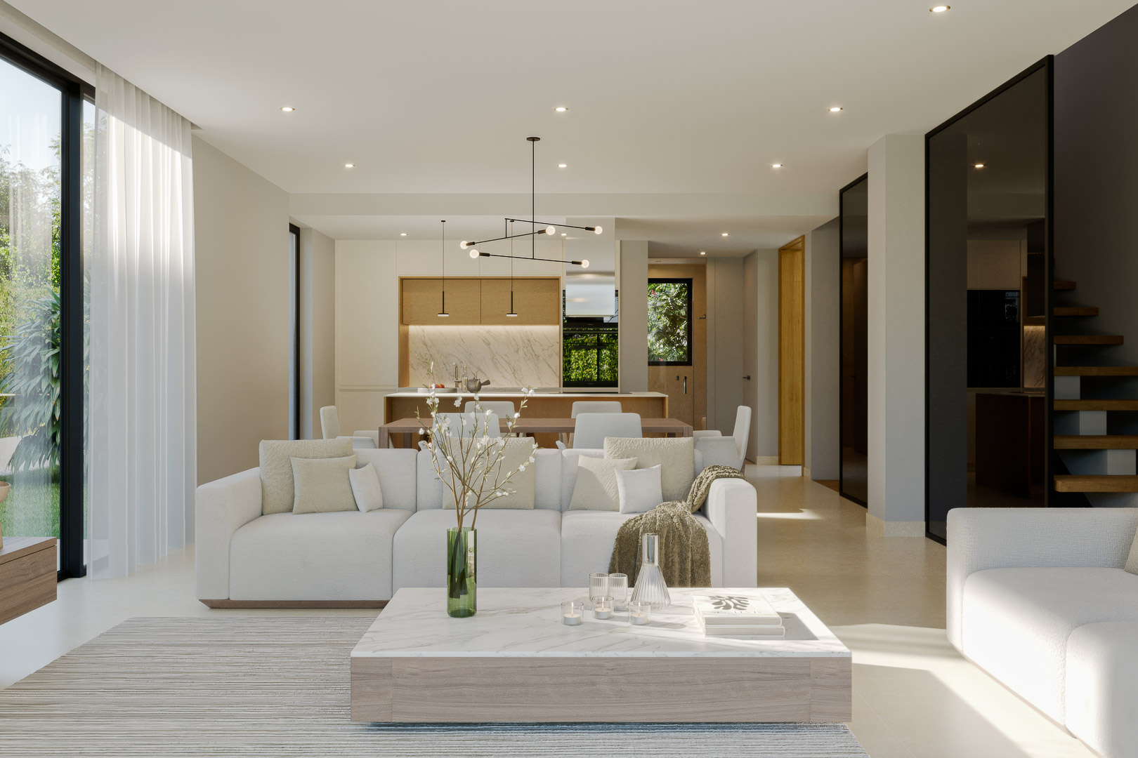 Salón de planta abierta con sofás blancos, mesa de centro de mármol y cocina integrada con acabados en madera. Grandes ventanales conectan el interior con el jardín.