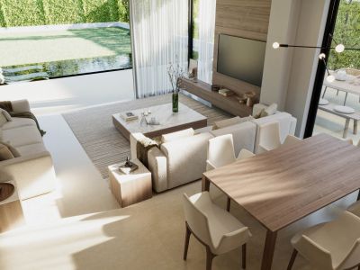Vista del salón-comedor con sofás tapizados, mesa de comedor de madera y acceso al jardín con piscina.