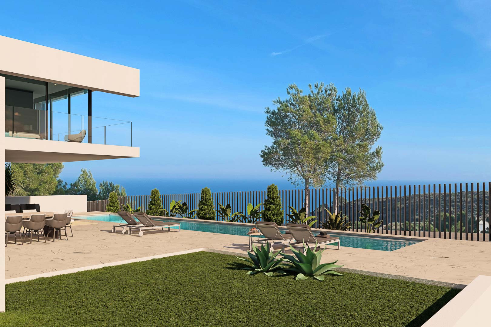 Vista de la piscina con tumbonas, jardín y vistas al mar de la villa en Moraira.