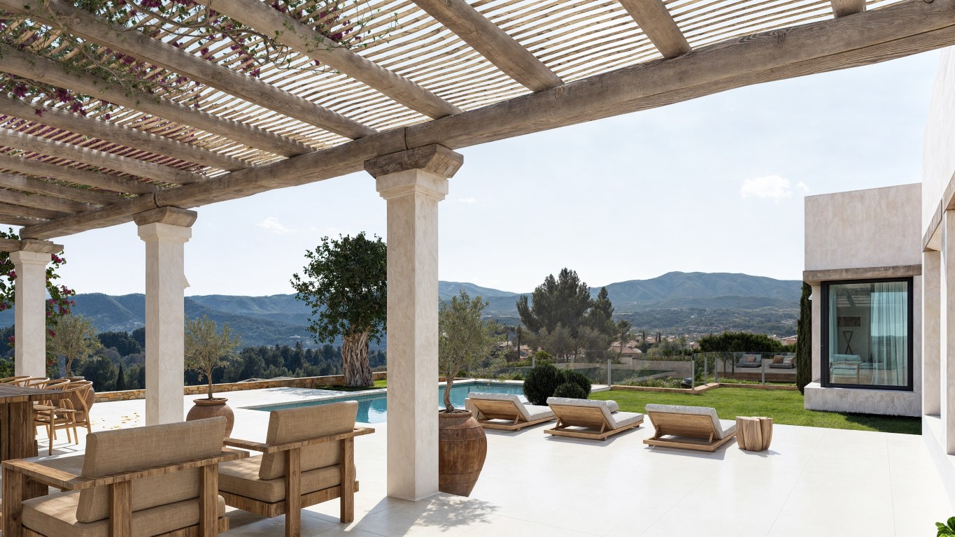 Terraza principal con pérgola de vigas de madera, zona de estar exterior y piscina rodeada de jardines con vistas despejadas al valle y las montañas.
