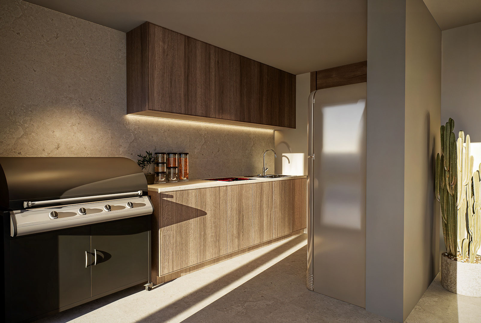 Cocina exterior con barbacoa integrada, mobiliario de madera, encimera de piedra y frigorífico de estilo retro bajo iluminación natural.