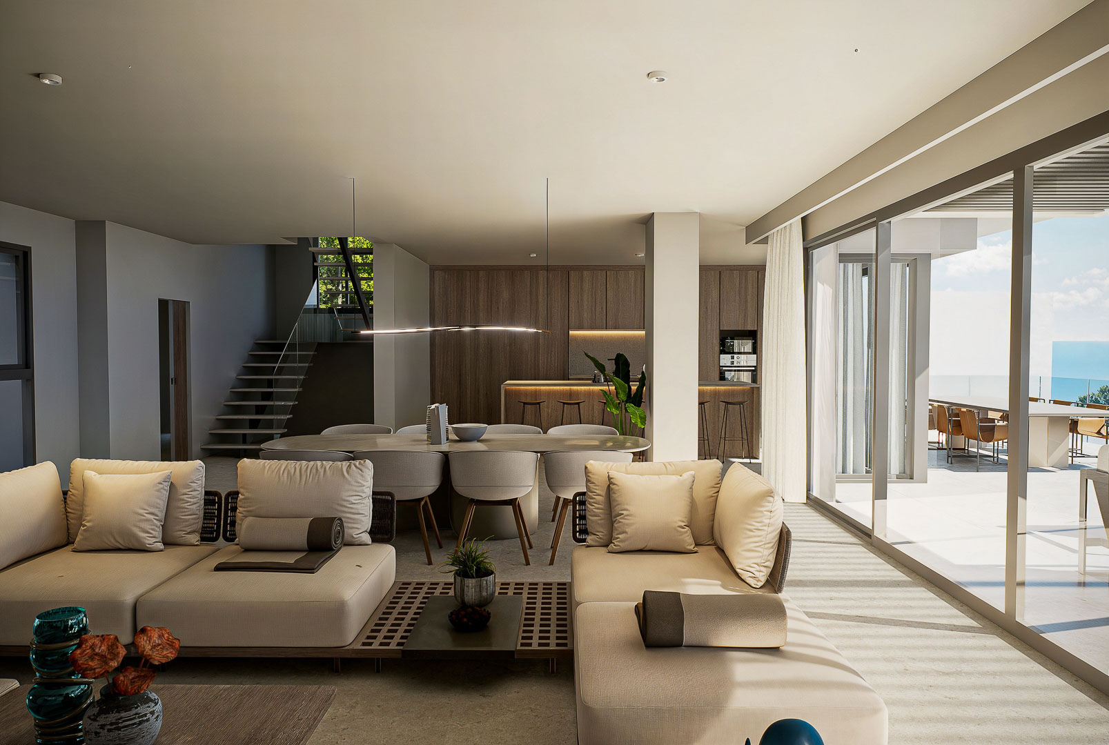 Salón-comedor de concepto abierto con ventanales de suelo a techo, cocina integrada con acabados en madera y acceso directo a la terraza con vistas al mar.