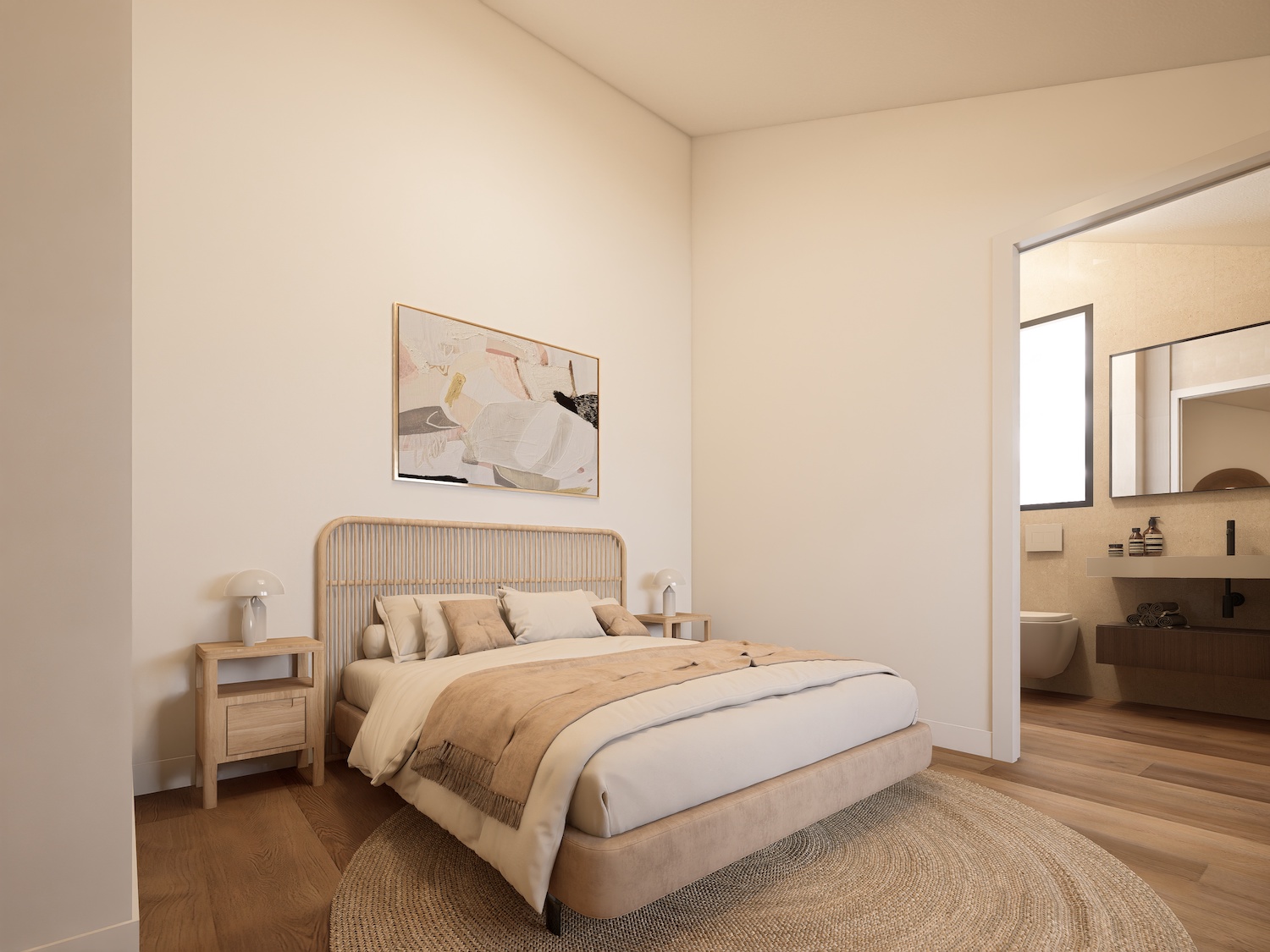 Dormitorio principal sereno con cabecero de ratán, mesitas de noche de madera clara y alfombra redonda de fibra natural. Se aprecia un baño moderno con tocador flotante.