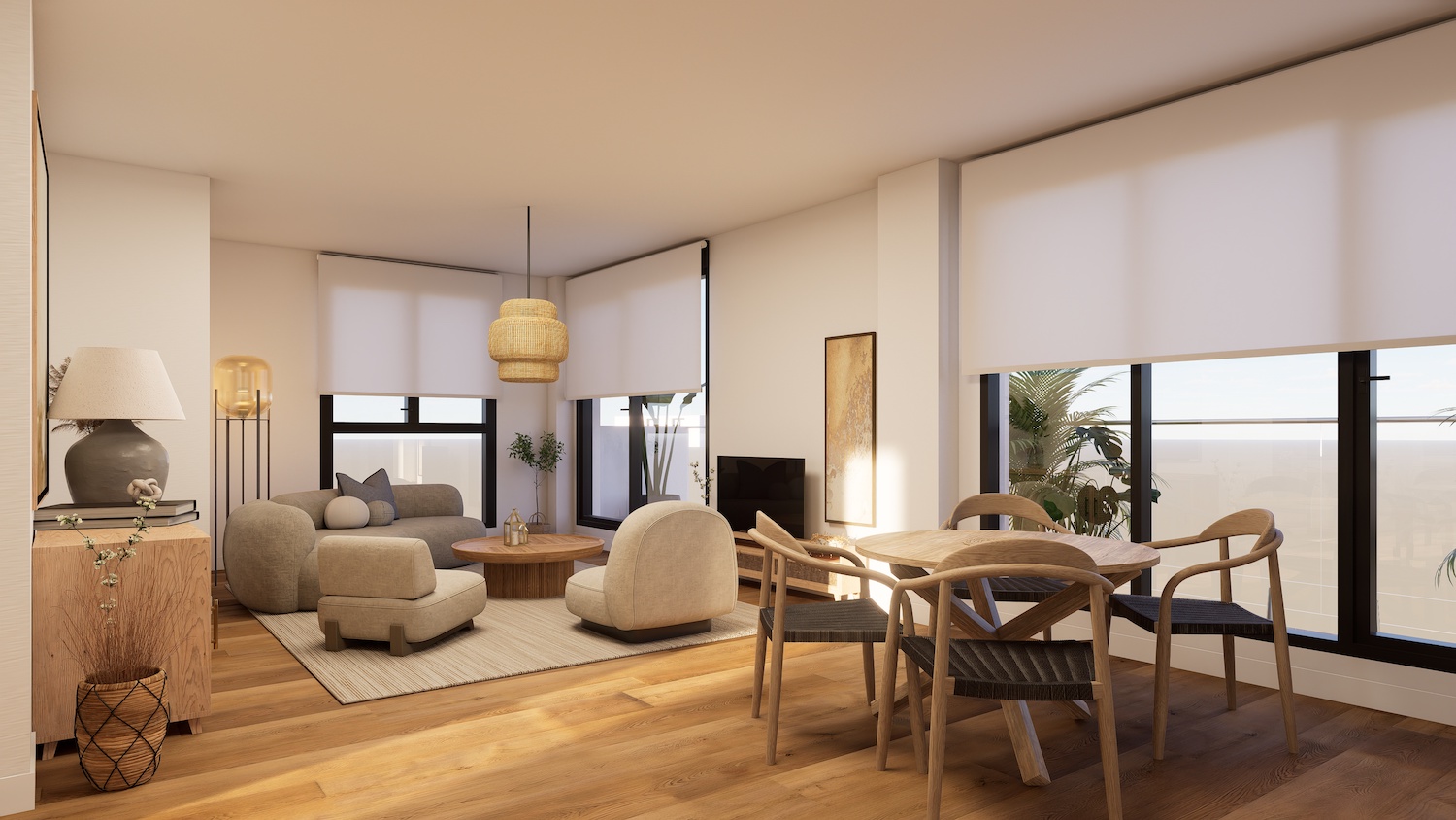 Luminoso salón-comedor de planta abierta con suelos de madera cálida y grandes ventanales. Destaca una mesa redonda de madera con sillas de mimbre y asientos neutros bajo una lámpara de fibras naturales.