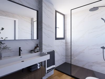 Baño moderno con elegantes azulejos efecto mármol, un mueble de lavabo flotante de madera oscura y un lavabo blanco integrado. Ducha a ras de suelo con mampara y grifería negra, iluminado por una ventana vertical.