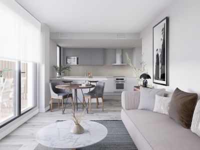 Salón-cocina de concepto abierto con sofá claro, mesa de centro de mármol y cocina compacta con armarios grises y electrodomésticos. Puertas acristaladas conectan con una terraza exterior.
