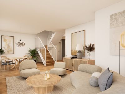 Salón-comedor de planta abierta con sofá curvo, dos sillones y mesa de centro de madera redonda sobre alfombra. Escalera moderna de madera con barandilla blanca conecta los niveles.