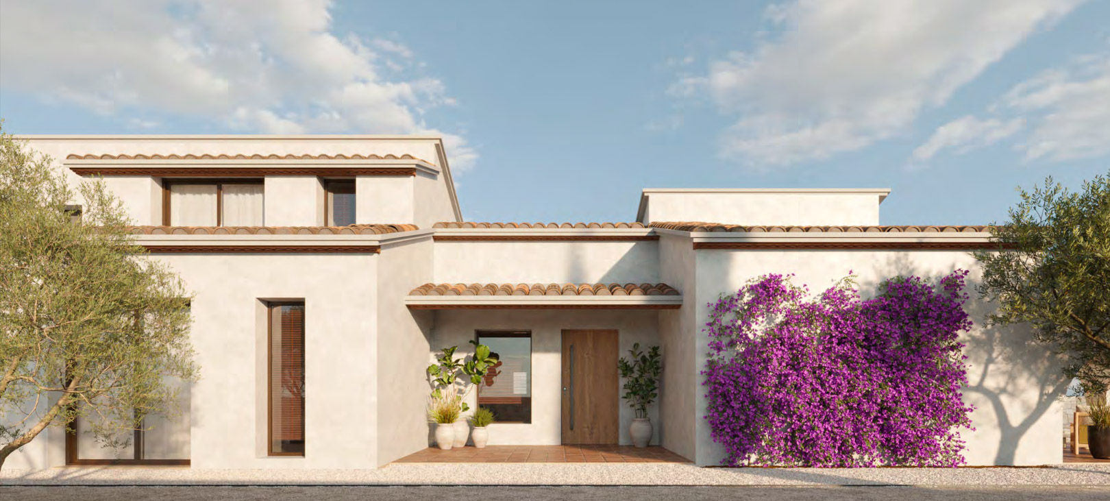 La fachada de la villa exhibe estuco blanco, tejas de terracota tradicionales y una puerta de entrada de madera. Una buganvilla vibrante decora una pared, junto a plantas en maceta y olivos.