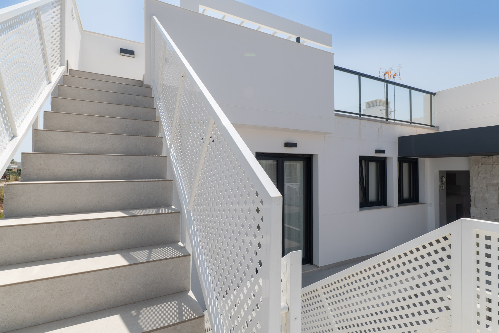Escalera exterior al solárium