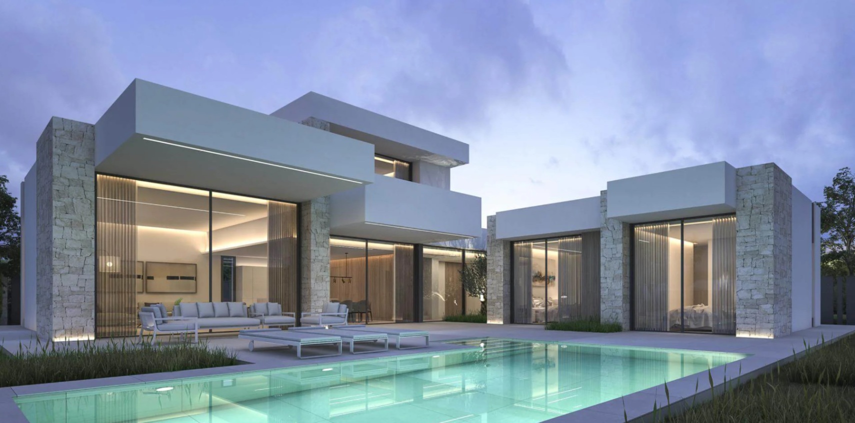 Exterior de villa moderna al atardecer con piscina turquesa, muros de piedra natural y grandes ventanales que iluminan la zona lounge.