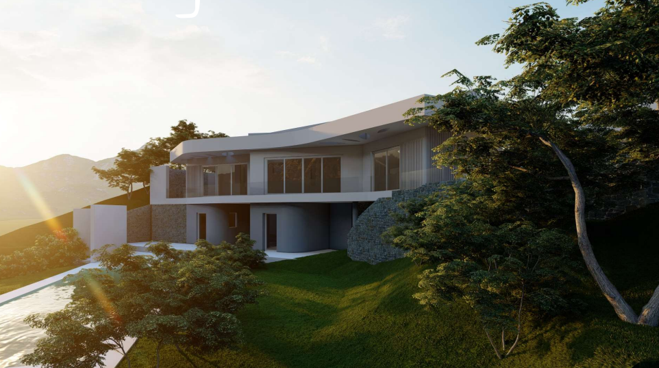 Villa moderna de dos niveles con cubierta curva, muros de piedra natural y amplios ventanales integrados en una ladera ajardinada bajo la luz del atardecer.