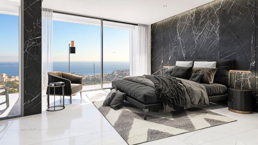 Dormitorio principal con pared de mármol, cama doble y vistas panorámicas al mar Mediterráneo. Dormitorio principal con pared de mármol, cama doble y vistas panorámicas al mar Mediterráneo.