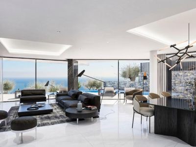 Espacioso salón-comedor con ventanales panorámicos y decoración moderna en tonos neutros.
