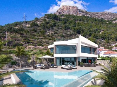 Vista exterior de la villa con piscina infinita y zona de estar, con vistas a la montaña.