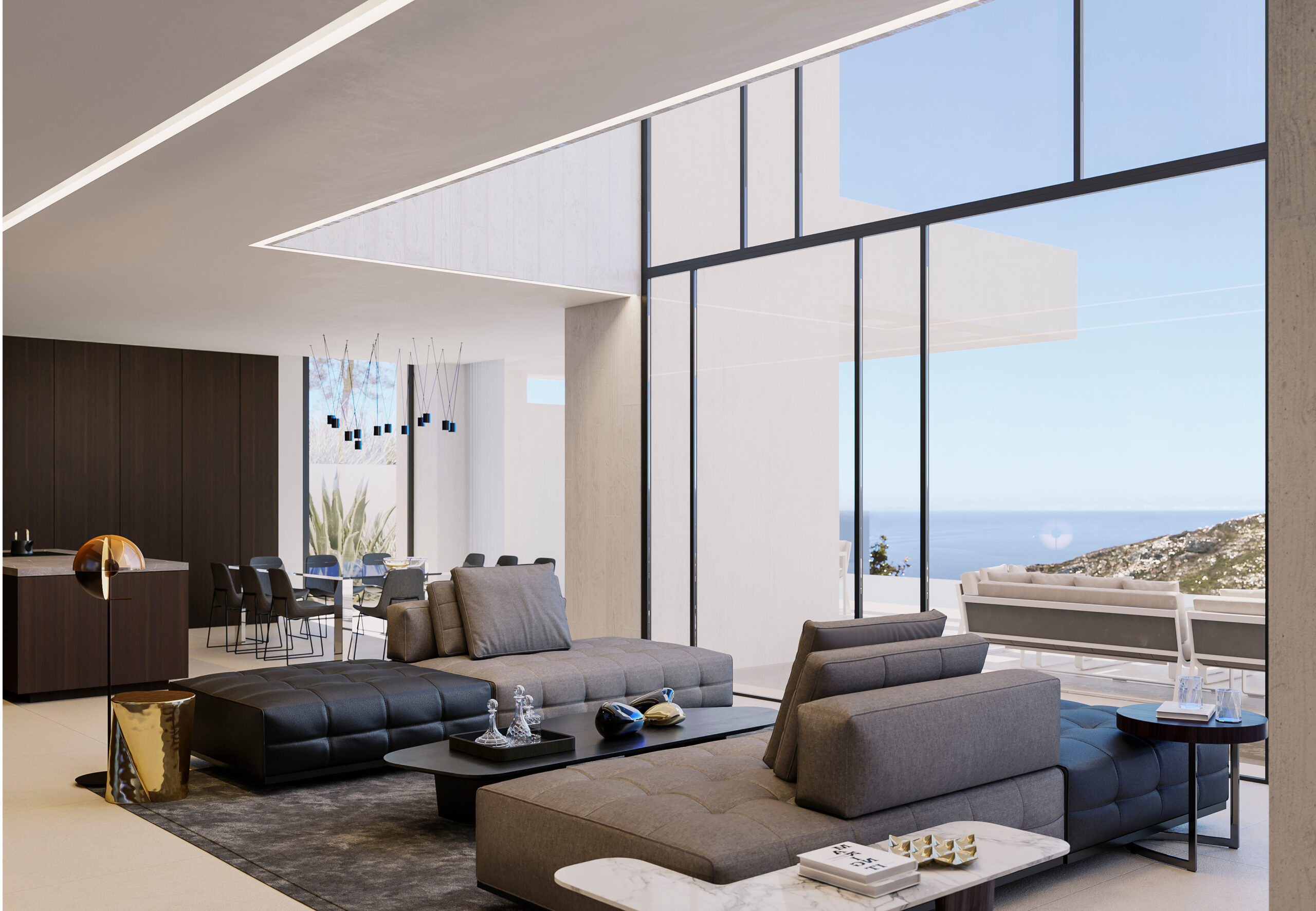Salón de concepto abierto con sofás modulares, ventanales de suelo a techo con vistas al mar y techo de doble altura con iluminación LED integrada.
