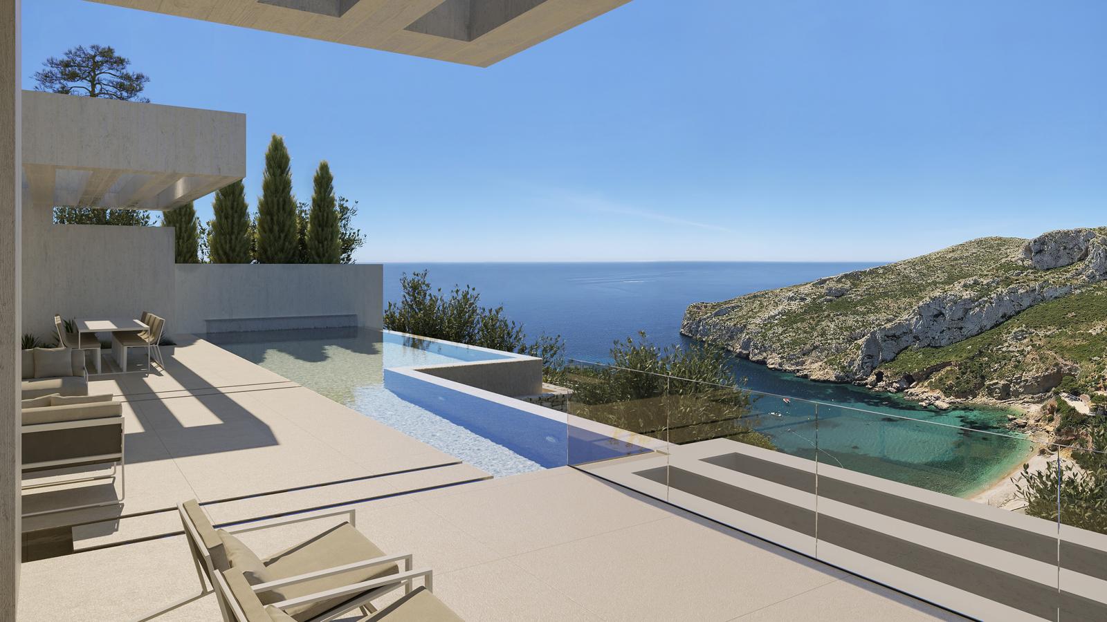 Terraza principal con piscina infinita de varios niveles, barandillas de cristal y vistas panorámicas frontales a la cala de la Granadella y el mar Mediterráneo.