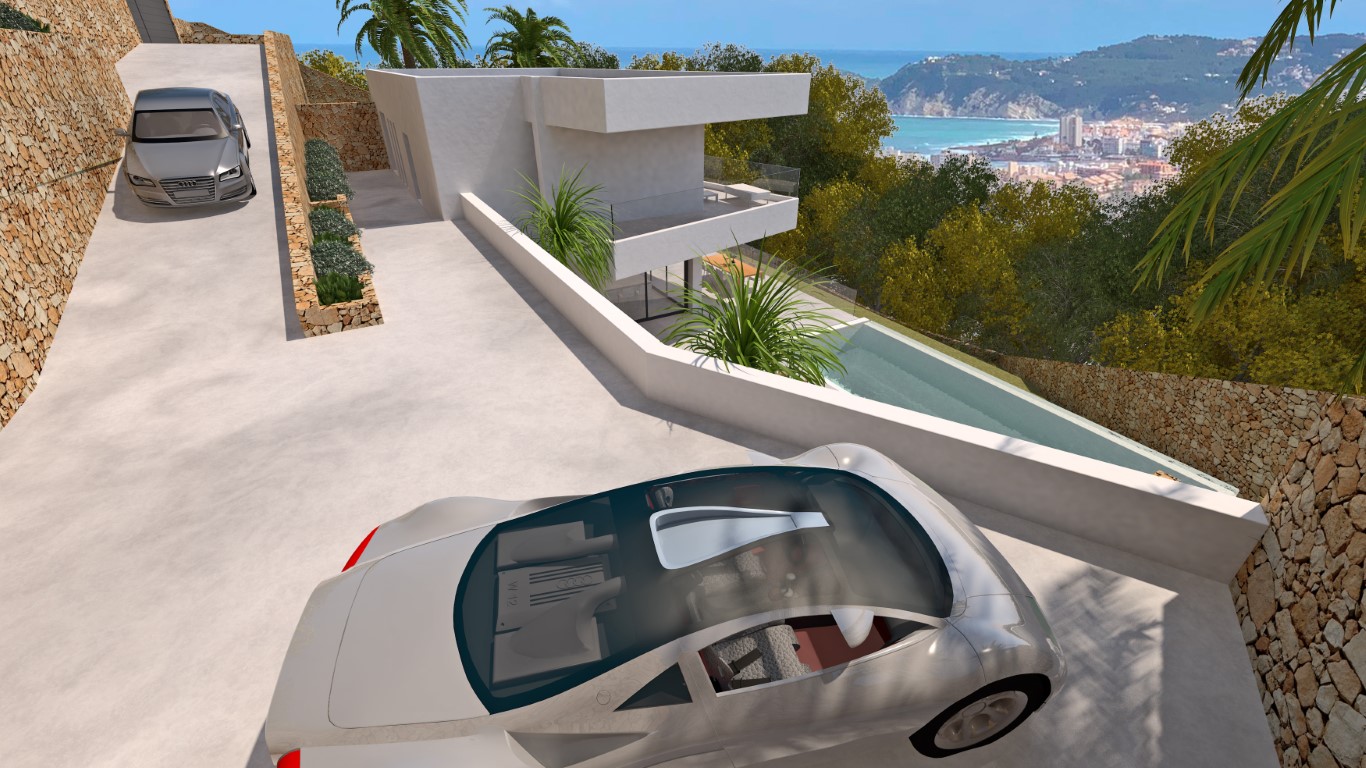 Vista elevada del acceso a la villa con muros de piedra seca, zona de aparcamiento y vistas panorámicas al mar y a la bahía de Jávea.