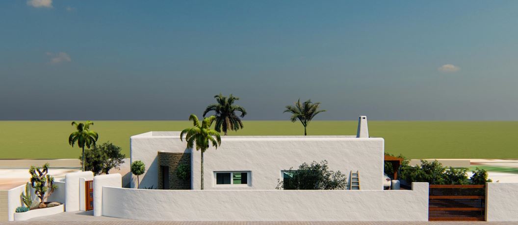 Fachada exterior de estilo ibicenco con muros blancos texturizados, detalles de piedra natural, portones de madera y palmeras integradas en el diseño arquitectónico.