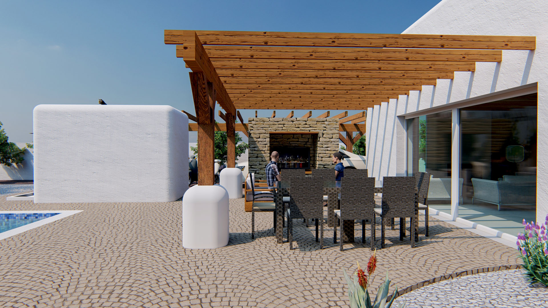 Terraza exterior con pérgola de madera, comedor para ocho comensales y pared de piedra natural con chimenea integrada junto a la zona de piscina.
