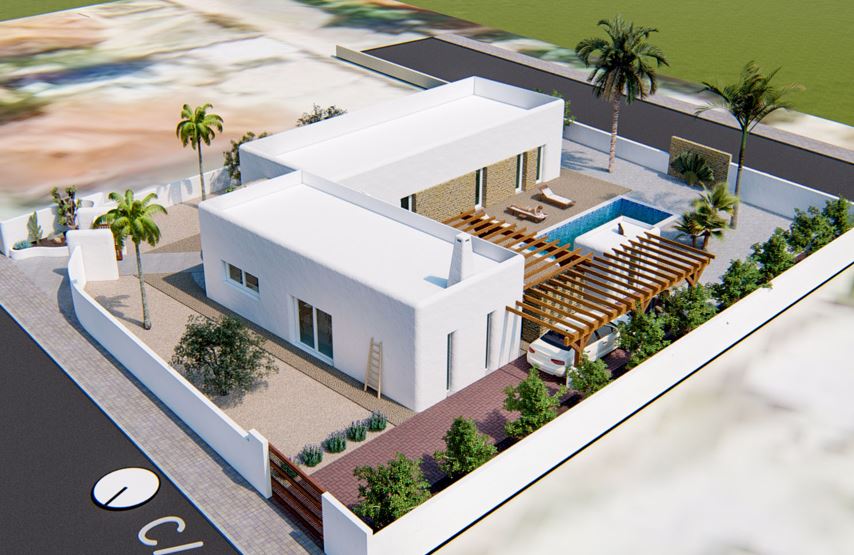 Vista aérea de la villa de estilo ibicenco con fachada blanca, piscina privada, amplias pérgolas de madera y jardín mediterráneo perimetral.