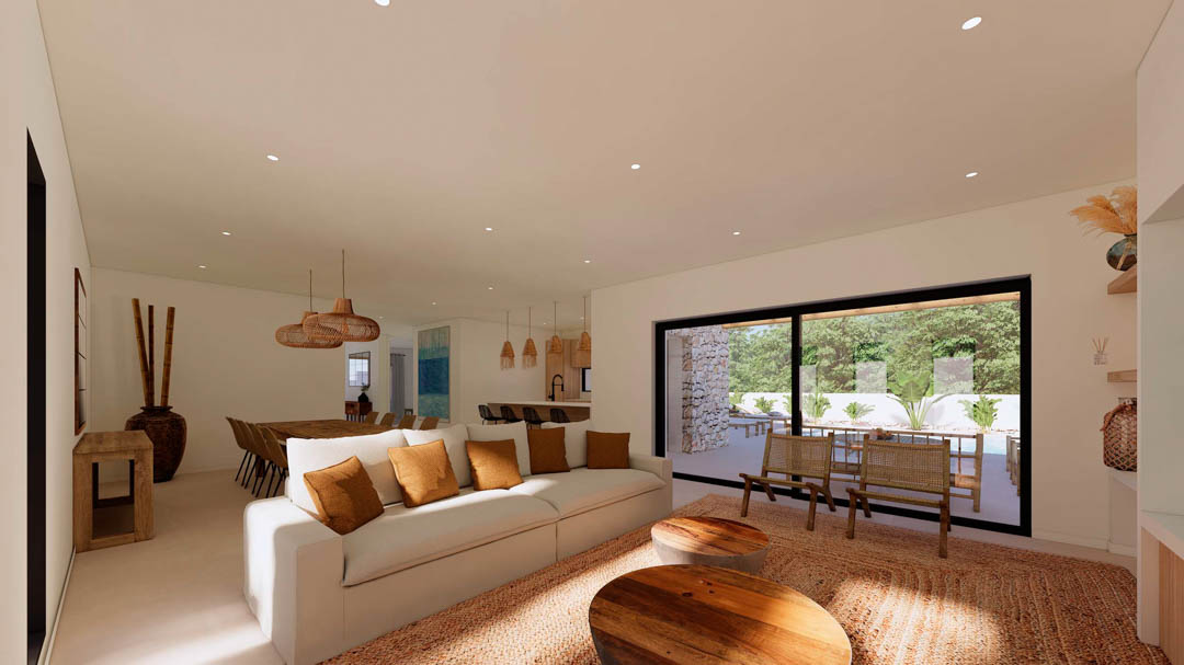 Amplio salón de concepto abierto con mobiliario en tonos tierra, techos con iluminación empotrada y grandes ventanales correderos hacia el jardín.