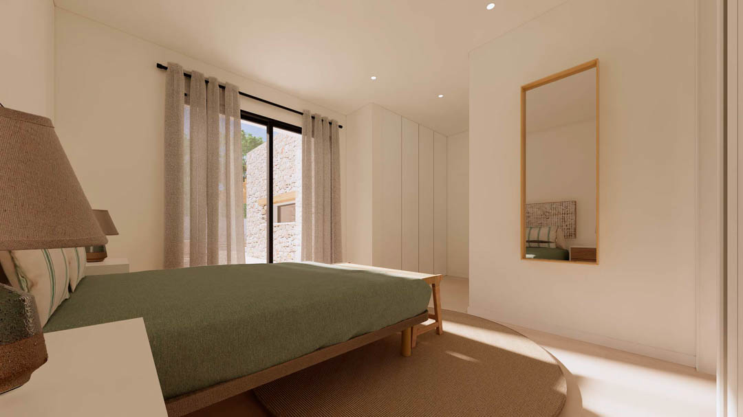 Dormitorio de diseño ibicenco con armarios empotrados, cama de madera y ventanales que conectan con el exterior, destacando el revestimiento de piedra natural.