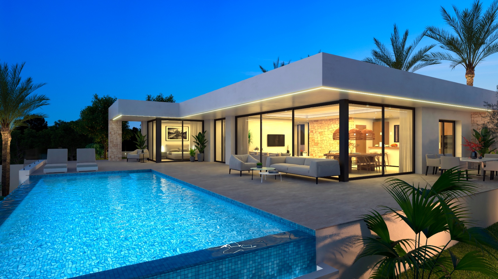 Vista nocturna de la villa con piscina de mosaico azul y terraza con mobiliario moderno.