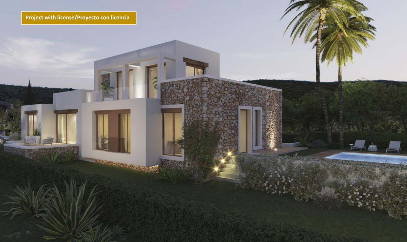 Vista exterior de la villa con fachada de piedra natural y paredes blancas, destacando la piscina iluminada y las terrazas superiores con barandillas de cristal.