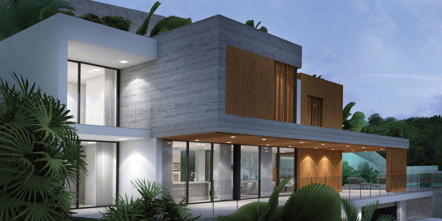 Fachada moderna de hormigón visto y madera con amplios ventanales. La planta baja iluminada muestra la cocina de concepto abierto conectada a una terraza cubierta con focos empotrados.