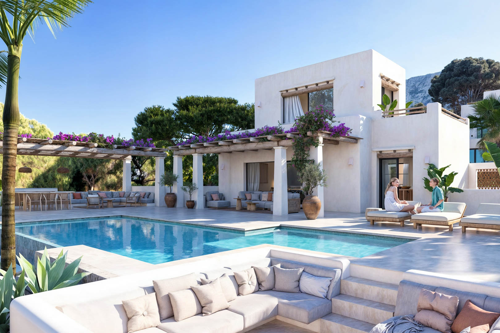 Vista de la piscina con pérgola cubierta de buganvillas y zona de estar con sofás de obra.
