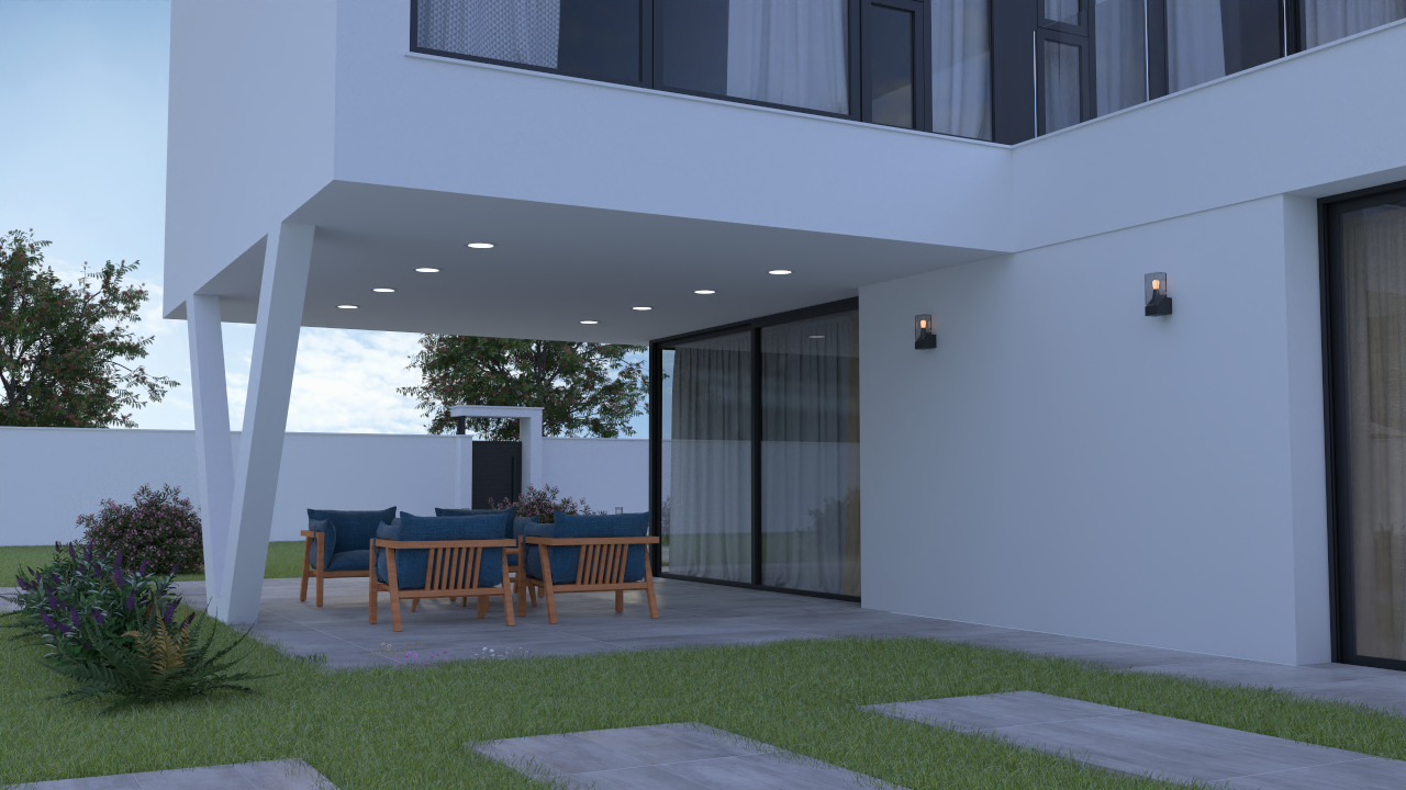 Terraza cubierta con iluminación integrada y mobiliario de madera, protegida por el voladizo de la planta superior y rodeada de un jardín con césped.