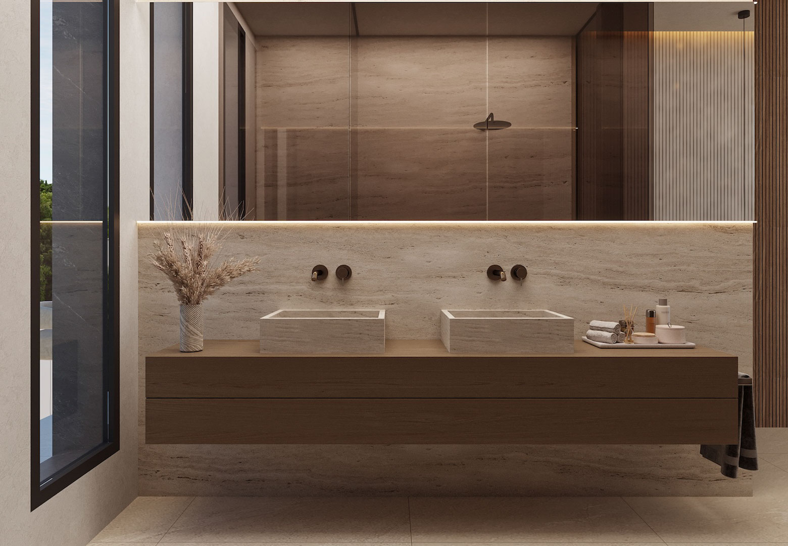 Baño de diseño con lavabo doble de piedra natural sobre mueble suspendido de madera. Incluye grifería empotrada, espejo retroiluminado y revestimientos en tonos crema.