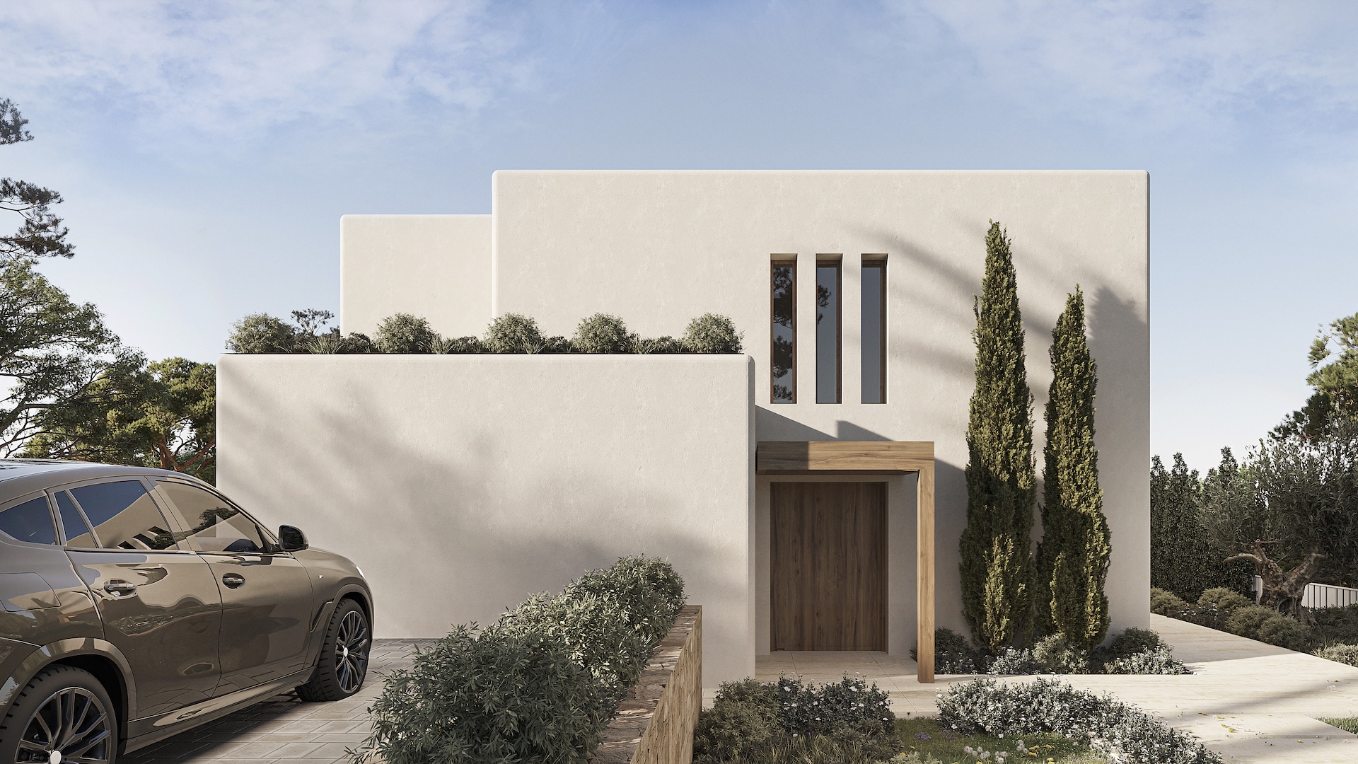 Fachada principal de estilo ibicenco con muros blancos texturizados, entrada de madera bajo dintel y ventanales verticales. El acceso cuenta con pavimentación de piedra y cipreses ornamentales.