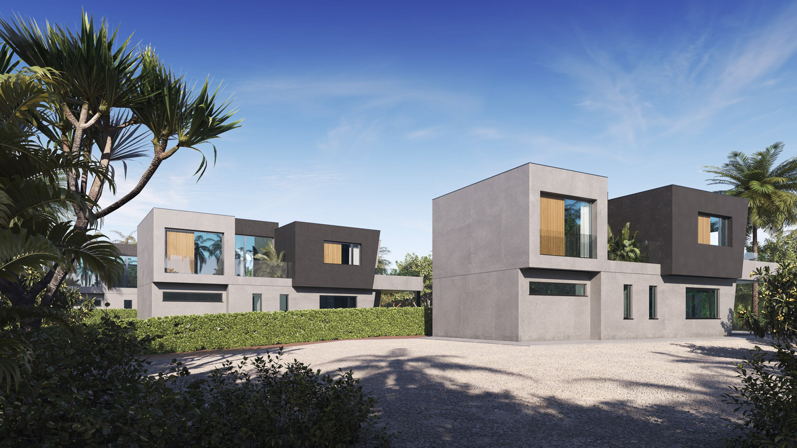 Vista exterior de las tres villas modernas con fachadas de hormigón y tonos oscuros, rodeadas de vegetación mediterránea y amplias zonas de acceso de grava.