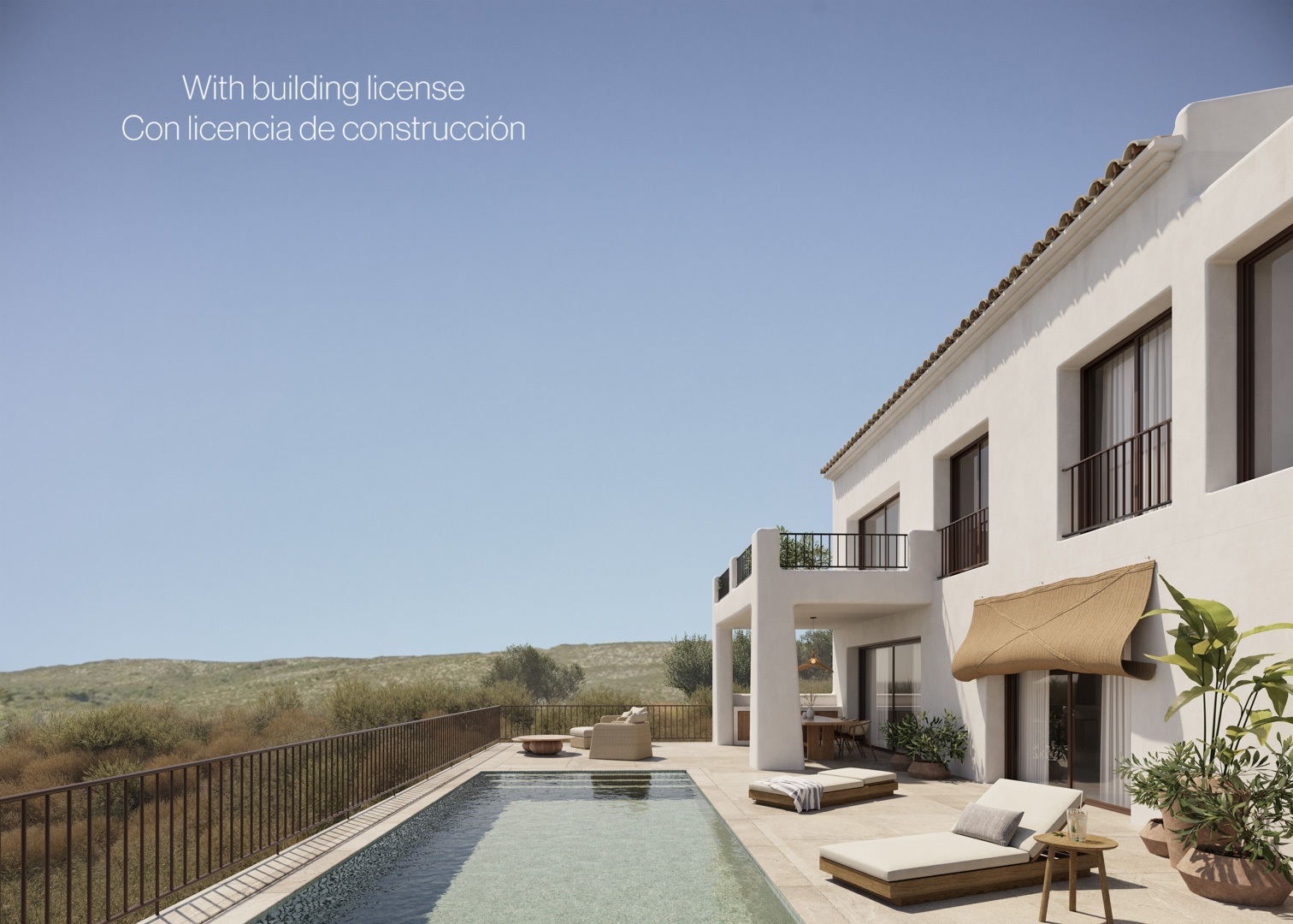 Fachada blanca de estilo ibicenco con piscina de 8x4 metros, terraza de piedra natural y porche cubierto frente al paisaje del valle de Jalón.