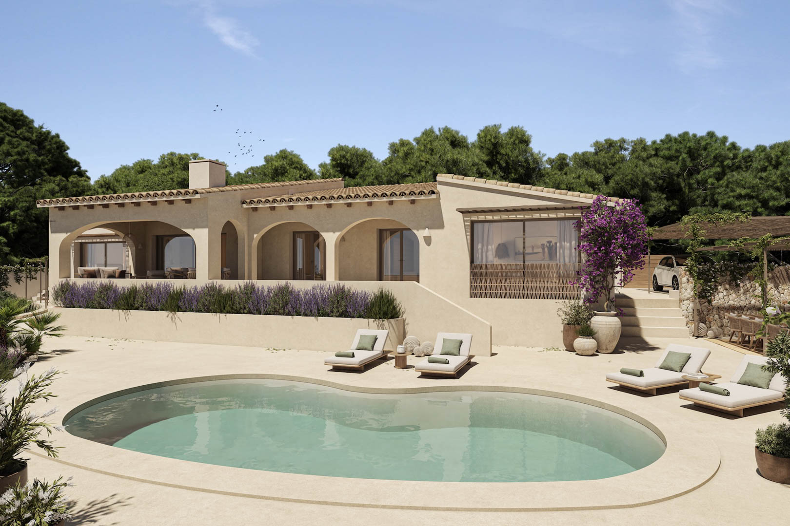 Villa mediterránea con porches de arcos, piscina de forma orgánica y terraza con tumbonas rodeada de lavanda y buganvillas en Benissa.