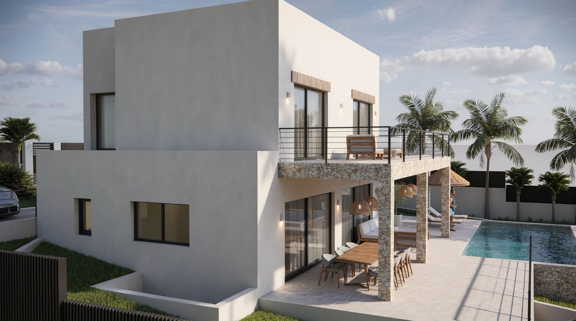 Fachada exterior de la villa con pilares de piedra natural, amplia terraza superior y porche con comedor junto a la piscina privada y jardín.
