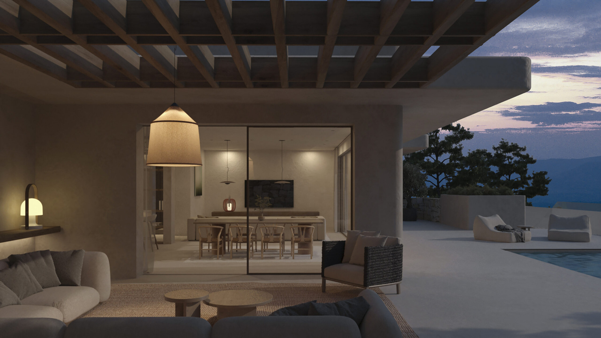 Acogedora zona de estar exterior bajo pérgola de madera, con sofás modernos y lámpara colgante, conectada a un comedor interior con vistas a la montaña al atardecer. Acogedora zona de estar exterior bajo pérgola de madera, con sofás modernos y lámpara colgante, conectada a un comedor interior con vistas a la montaña al atardecer.