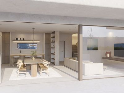 Amplio salón-comedor de diseño abierto con mesa de madera y barra de desayuno, conectado a la terraza mediante grandes puertas correderas de cristal.