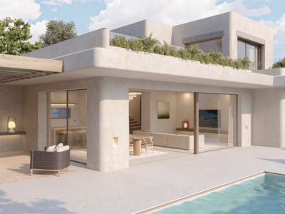Vista exterior de villa contemporánea con piscina privada. Destaca la terraza con pérgola de madera, zona lounge exterior y amplios ventanales que conectan con el interior diáfano.