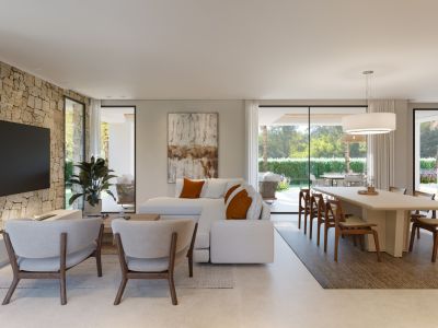 Amplio salón-comedor de planta abierta con pared de piedra, mobiliario moderno y acceso directo al jardín a través de grandes puertas de cristal.
