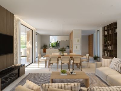 Salón-comedor y cocina de concepto abierto. Destacan la pared de TV panelada en madera, sofás claros, mesa de comedor de madera y estantería integrada. Grandes puertas de cristal conectan al exterior.