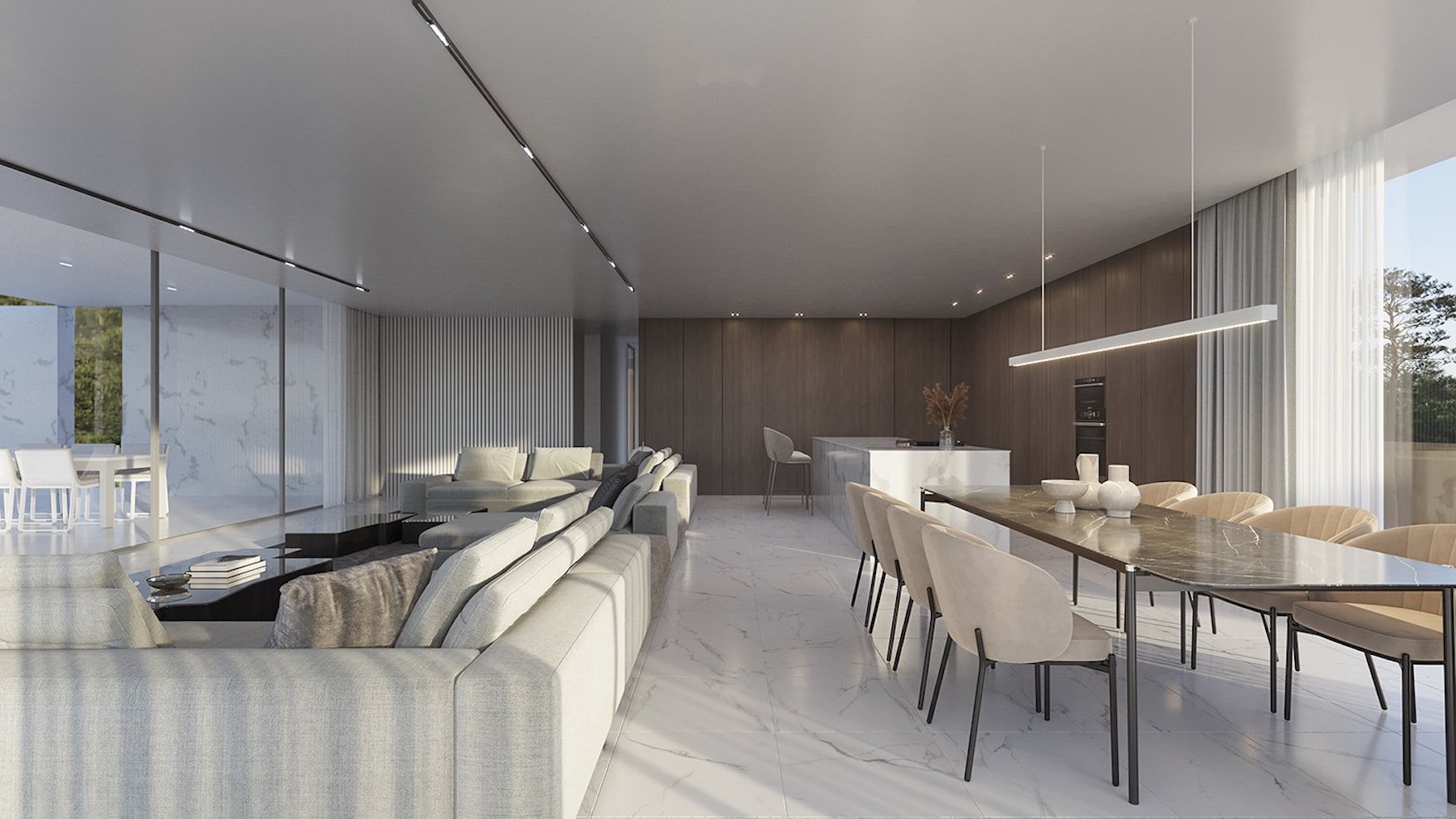 Amplio salón de concepto abierto con suelos de mármol, zona de comedor con mesa de piedra y cocina integrada con panelado de madera y ventanales de suelo a techo.