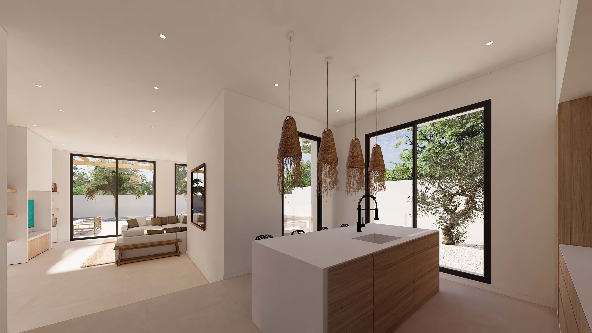 Cocina de diseño con isla de madera y encimera blanca, iluminada por lámparas de fibras naturales. El espacio abierto conecta con el salón y ofrece vistas al jardín y la piscina.